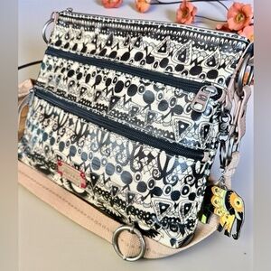 SAKROOTS Artist Circle Flat Crossbody Bag.